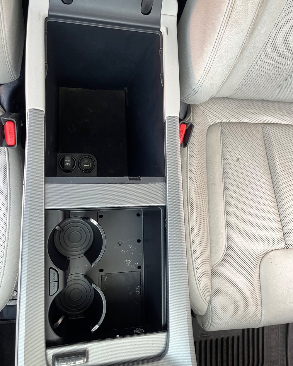The rear console cleaned and reinstalled by Alum Auto Detailing, Westerville
