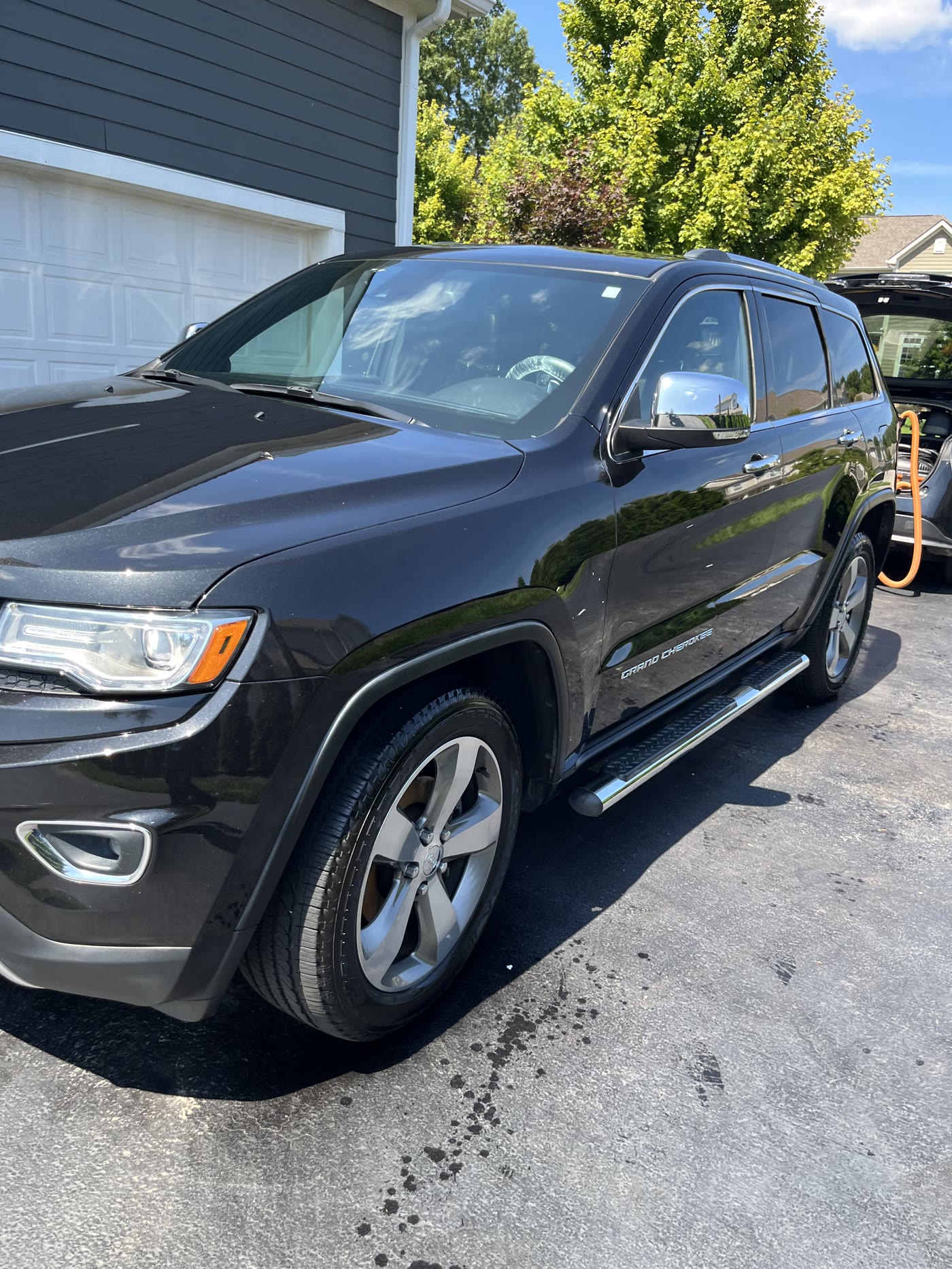 A black Grand Cherokee cleaned up in the drive by Alum Auto Detailing, Westerville